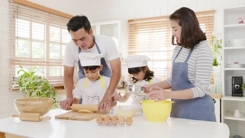 Family Baking Together in Bright Kitchen