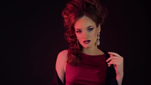 Glamorous Woman Posing in Red Dress and Shawl