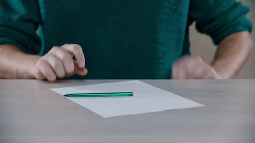 Sheet of paper with pen on a table