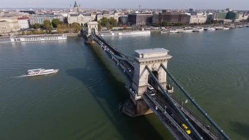 Aerial shot of a chain bridge in Budapest during autumn.