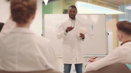 Medical Professional Explains Anatomy to Students
