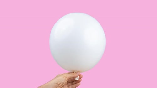 Hand Holding White Balloon