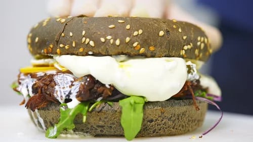 Close Up of Delicious Burger with Black Bun