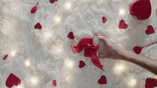 Romantic Gift Presentation With Hearts and Lights