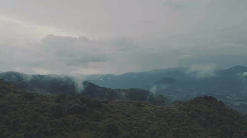 Lush Green Mountains and Misty Landscape Aerial