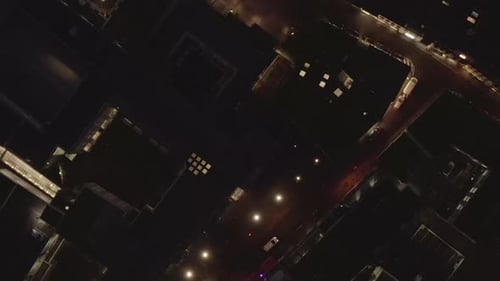 AERIAL: Slow Overhead Shot of City at Night with Lights and Traffic, Cologne, Germany