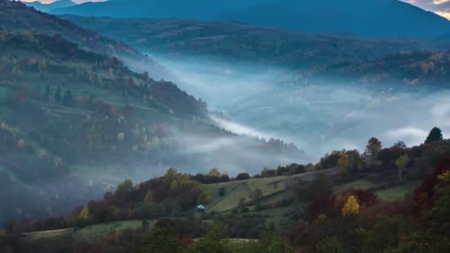 Majestic Mountain Range at Foggy Sunrise