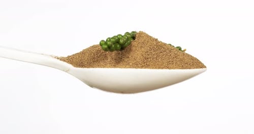Ground Pepper with Green Peppercorns on Spoon