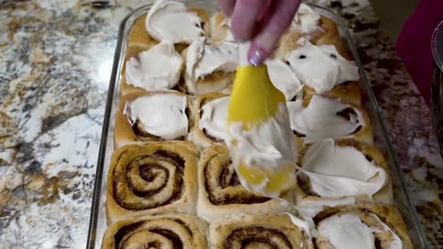 Icing Freshly Baked Cinnamon Rolls at Home