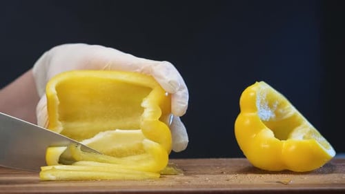 Yellow Bell Pepper Sliced on a Cutting Board