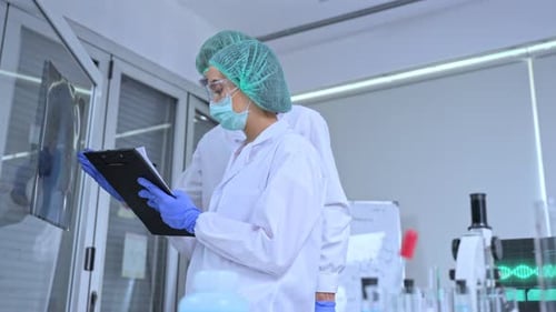 Medical Researchers Examine X-ray in Bright Lab