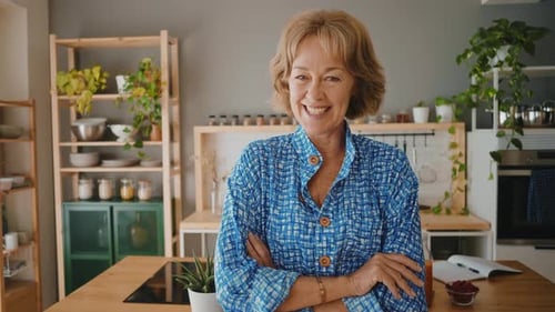 Smiling Woman with Blonde Hair in Kitchen