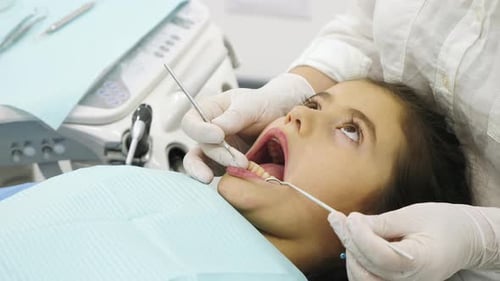 Girl Having a Dental Checkup at a Clinic
