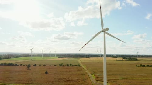 Wind Turbines in a Field on a Beautiful Sunset Aerial View