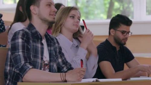 Students Attending Lecture in University Classroom