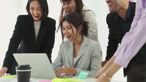 Successful Team Celebrates at the Office