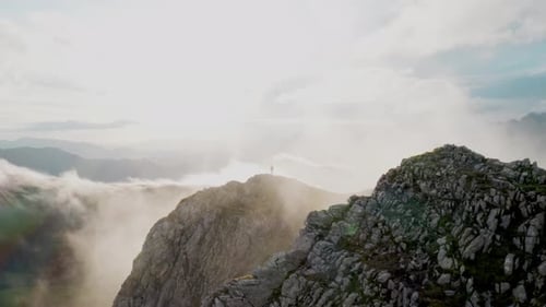 Drone Shot of Hiker on Mountain Cloudy Top