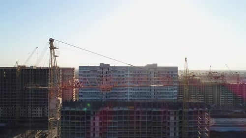 Aerial View of City Block Construction and Construction Crane