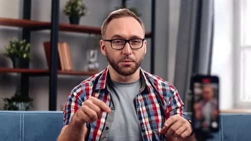 Modern Male Blogger Recording Video Use Smartphone Screen Talking Communication to Auditorium