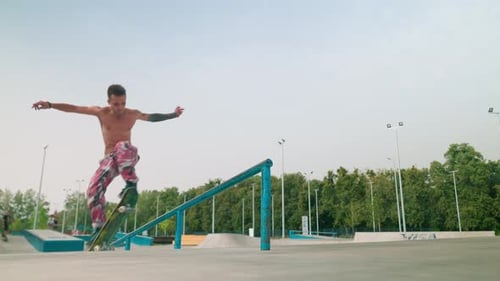 Skateboarder Performs Trick in an Urban Skatepark
