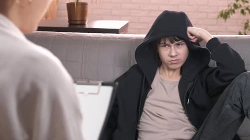 Teen in Therapy Session with Counselor