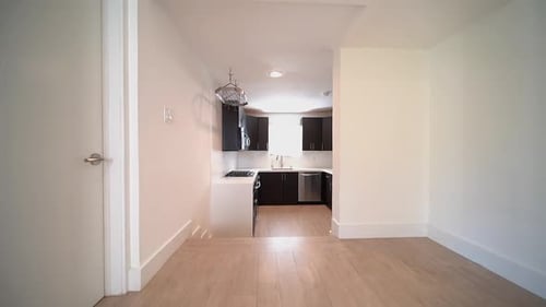 Modern Kitchen with Stainless Steel Appliances and Dark Cabinets