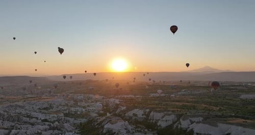 Aerial Cinematic Drone View of Colorful Hot Air Balloon Flying Over Cappadocia