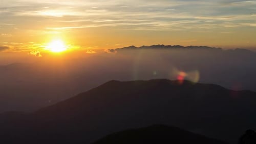 Golden Sunrise Over Mountain Range