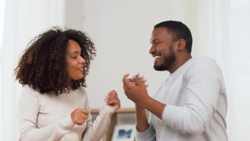 Happy Couple Dancing Together and Having Fun