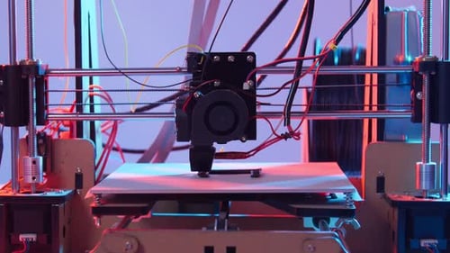 3D Printing or Additive Manufacturing and Robotic Automation Concept.. Working 3d Printer on a Color