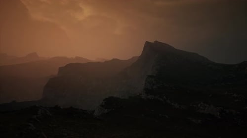 Dramatic Sky Over Rocky Mountains at Sunset