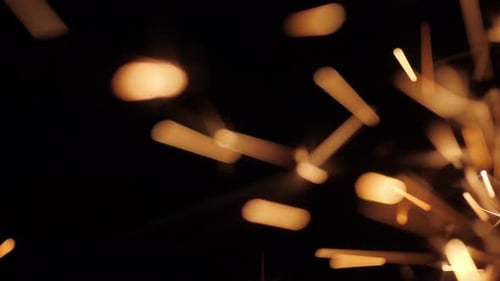 Golden Sparklers on Black Background Close Up