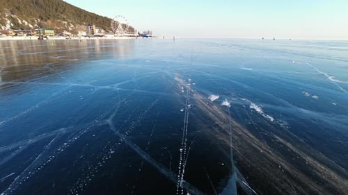 Wind Blows Snow Over Ice of Baikal