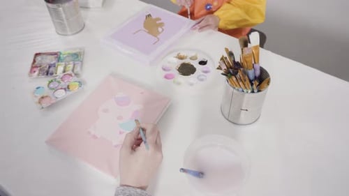 Little Girl Painting with Acrylic Paint on Canvas with Her Mother for a Distant Learning Art Project