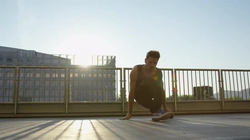 Young Man Breakdancing Outdoors in Urban Setting
