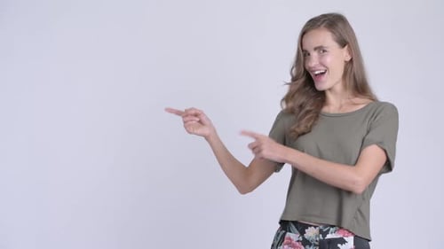 Woman Gesturing and Pointing Towards the Left Side