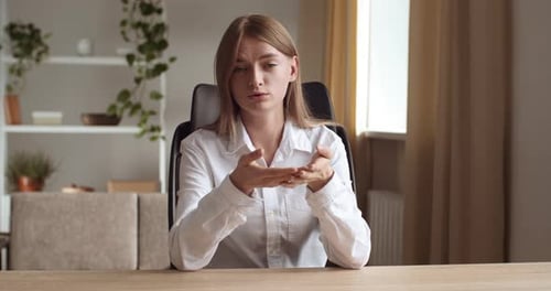 Woman Talking During Web Conference at Home