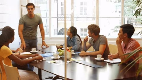 Diverse Group Meeting in Modern Workplace