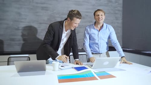 Excited Team Cheers at Modern Office Workplace