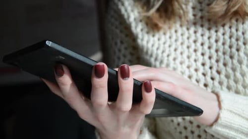 Woman uses Tablet Close Up