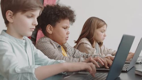 Students Typing on Computers on Lesson