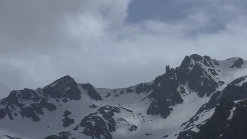 Snowy mountains and moving smoke