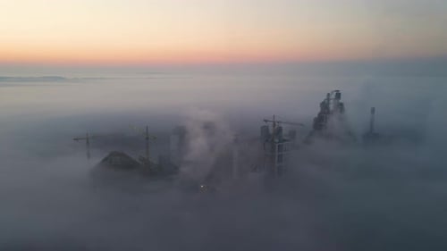 Aerial View of Cement Factory with High Concrete Plant Structure and Tower Crane at Industrial