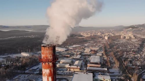 Video with a Flight Over a Thermal Power Plant From Which Smoke Comes Out in Winter