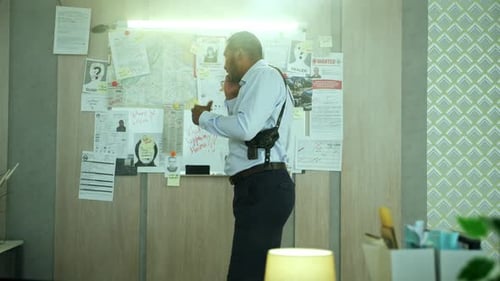 Detective on Phone in Office Investigating Crime