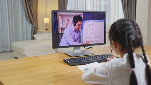 Girl Learning Math Online With Teacher on Computer