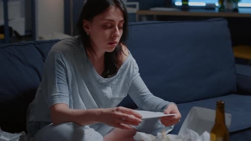 Woman Overwhelmed By Many Problems Reading Eviction Notice