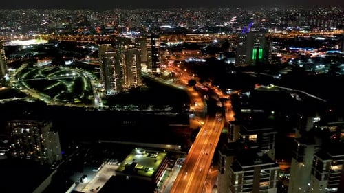 Night city landscape at downtown district. Buildings and traffic.