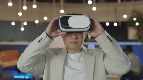 Office Male Worker Wearing a VR Headset Virtual Reality Concept
