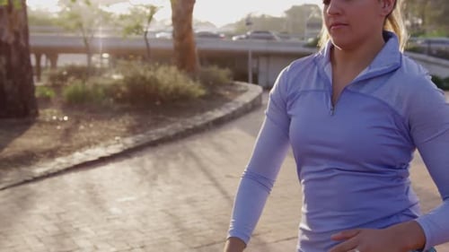 Caucasian woman stretching in a park